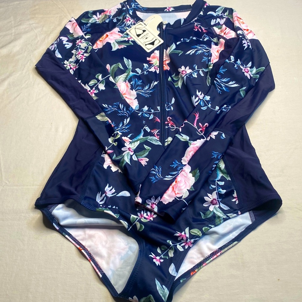 Lady Koly woman’s zip up leotard size med blue with pink flowers
